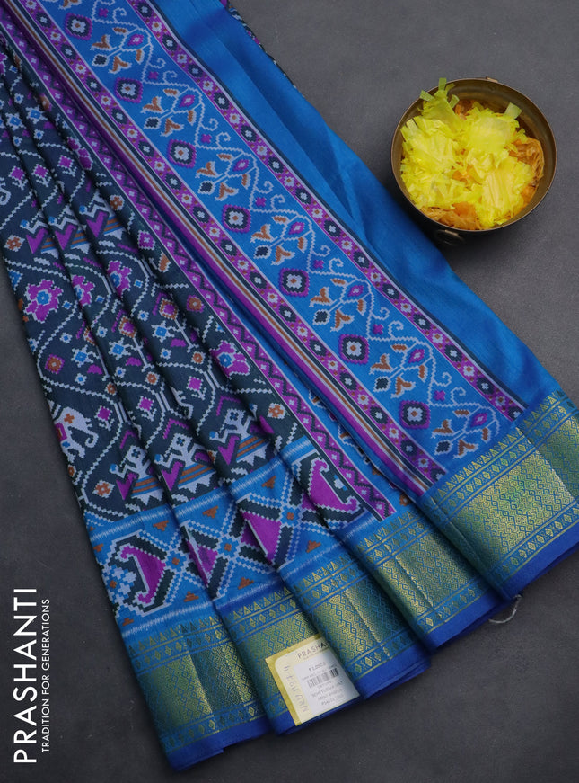 Semi tussar saree dual shade of bluish green and blue with allover ikat prints and zari woven border