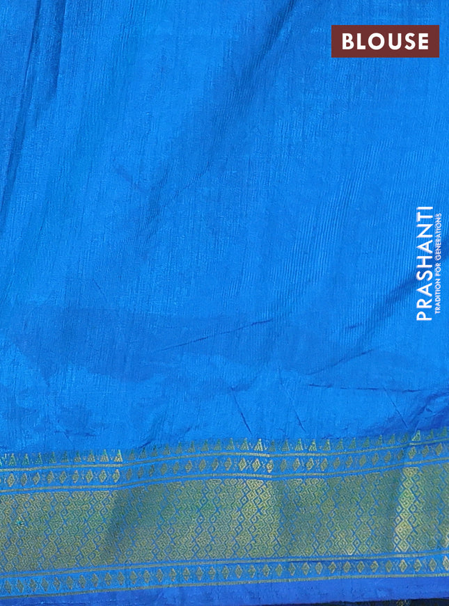 Semi tussar saree dual shade of bluish green and blue with allover ikat prints and zari woven border
