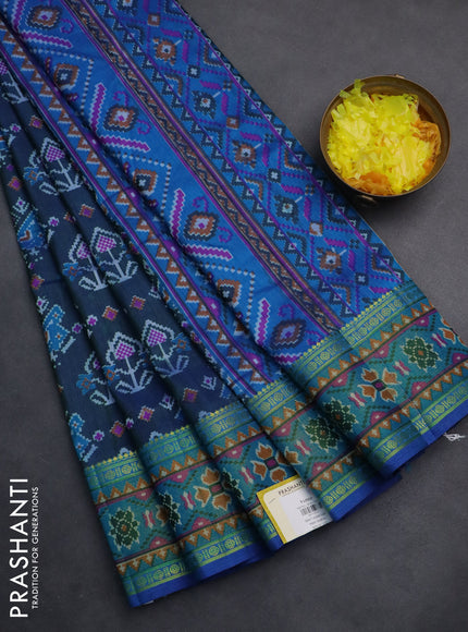 Semi tussar saree dual shade of bluish green and blue with allover ikat prints and zari woven border