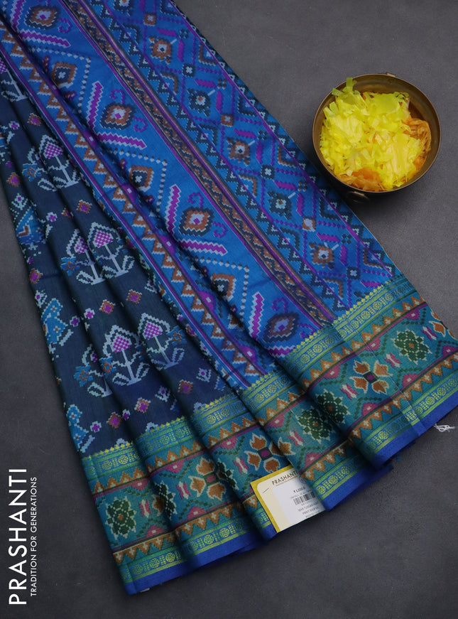 Semi tussar saree dual shade of bluish green and blue with allover ikat prints and zari woven border