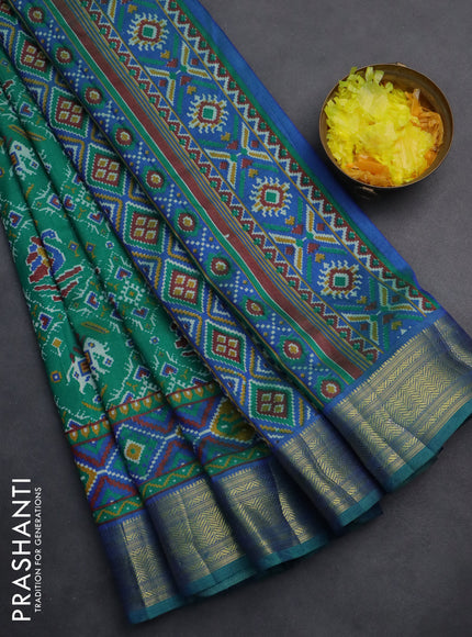Semi tussar saree teal green and blue with allover ikat prints and zari woven border