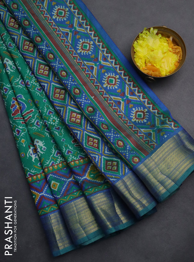 Semi tussar saree teal green and blue with allover ikat prints and zari woven border