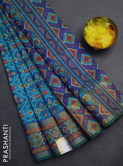 Semi tussar saree teal blue with allover ikat prints and zari woven border