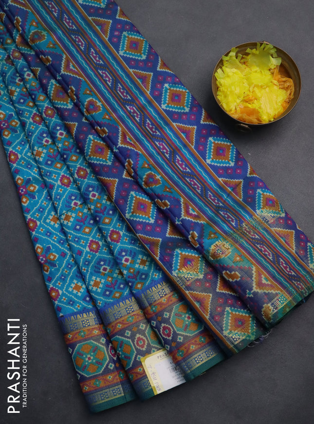 Semi tussar saree teal blue with allover ikat prints and zari woven border