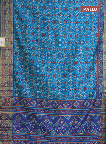Semi tussar saree teal blue with allover ikat prints and zari woven border