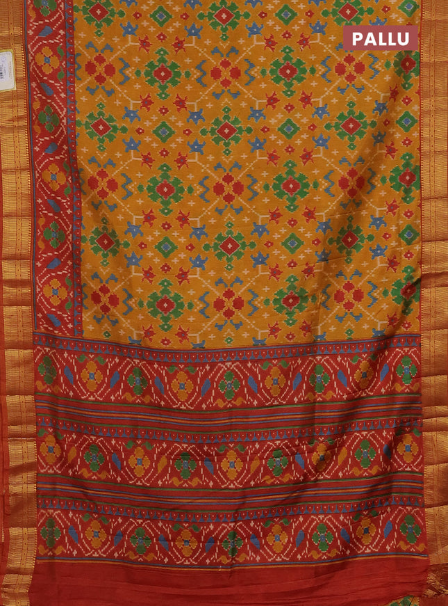 Semi tussar saree mustard yellow and red with allover ikat prints and zari woven border