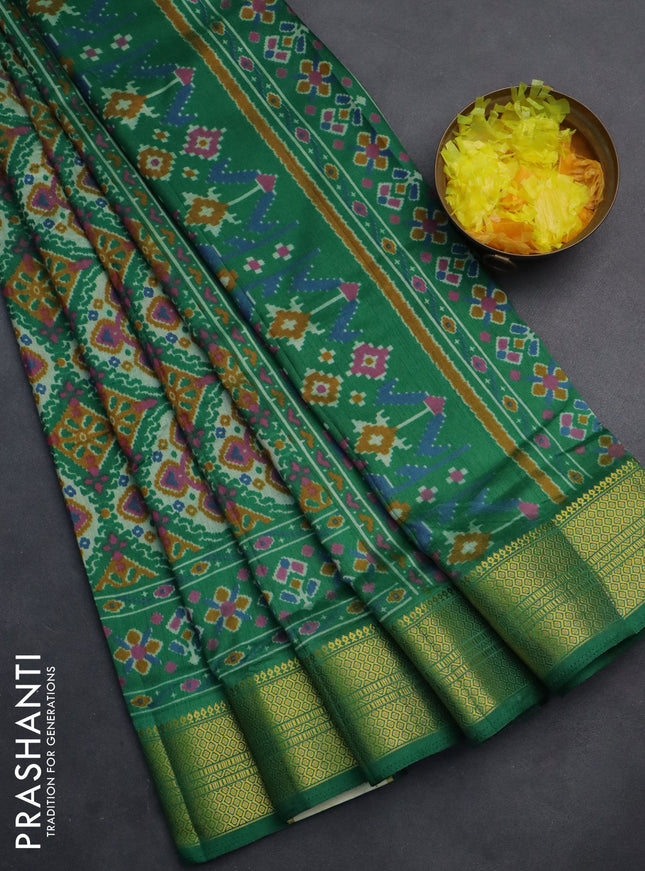 Semi tussar saree green with allover ikat prints and zari woven border