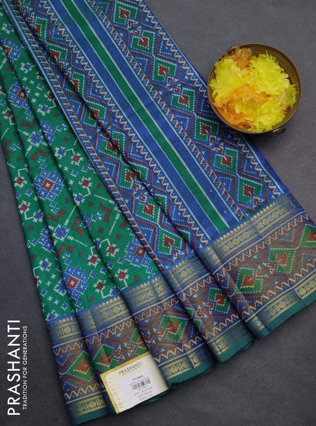 Semi tussar saree green and blue with allover ikat prints and zari woven border