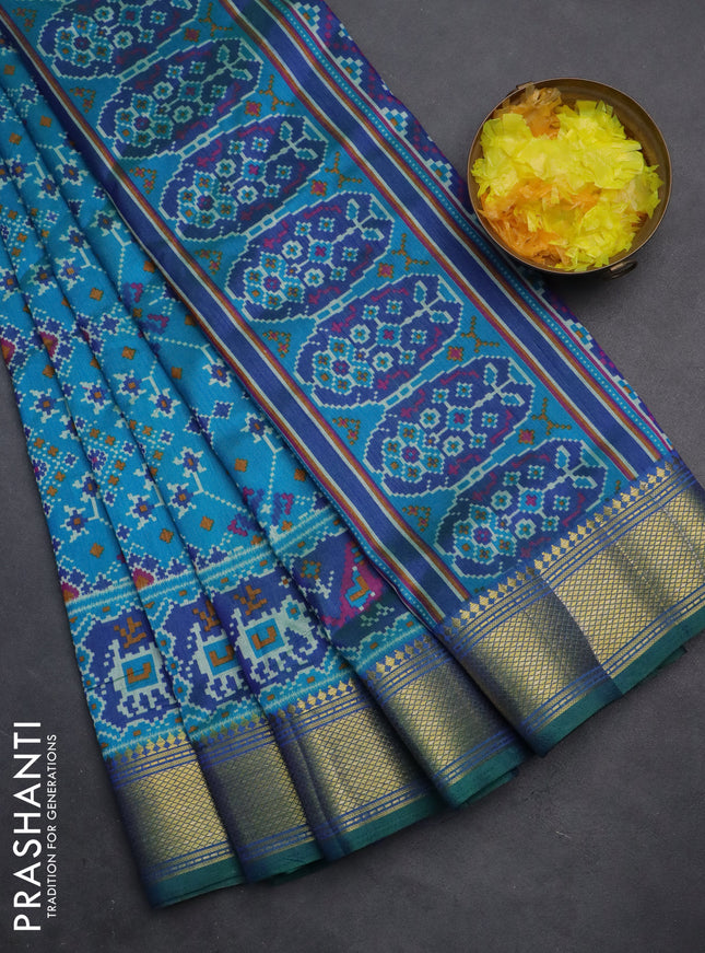 Semi tussar saree cs blue and green with allover ikat prints and zari woven border