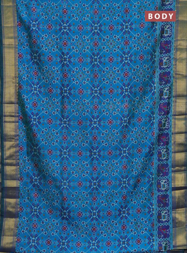 Semi tussar saree cs blue and green with allover ikat prints and zari woven border