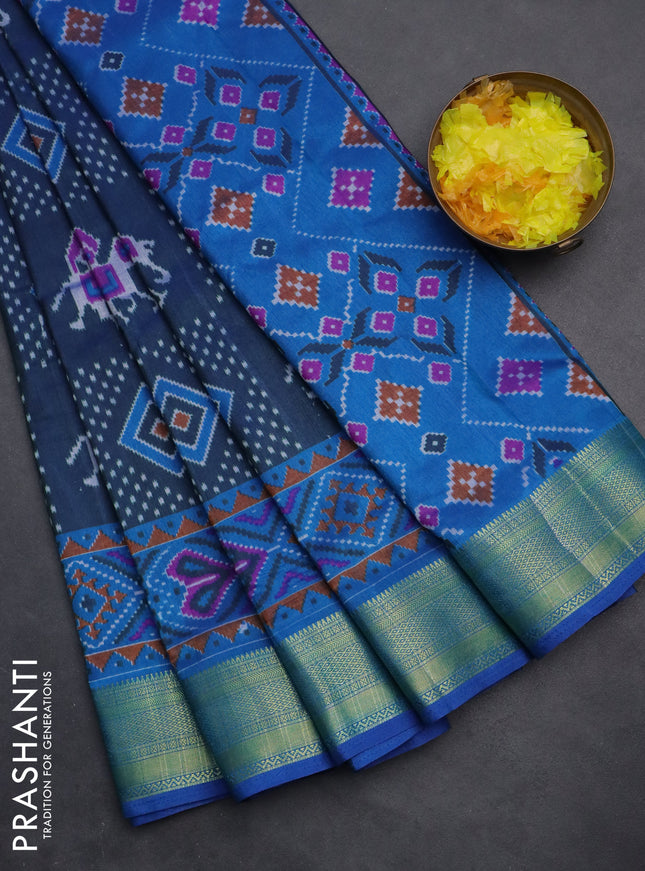 Semi tussar saree dual shade of bluish green and blue with allover ikat prints and zari woven border