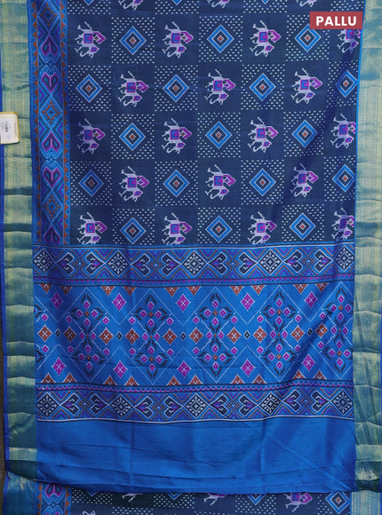 Semi tussar saree dual shade of bluish green and blue with allover ikat prints and zari woven border