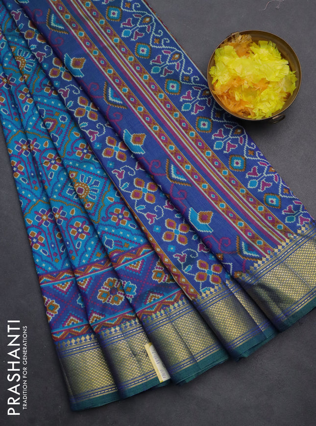 Semi tussar saree dual shade of teal and blue with allover ikat prints and zari woven border