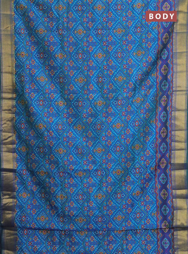 Semi tussar saree dual shade of teal and blue with allover ikat prints and zari woven border