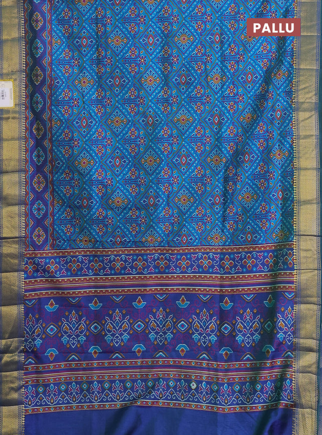 Semi tussar saree dual shade of teal and blue with allover ikat prints and zari woven border