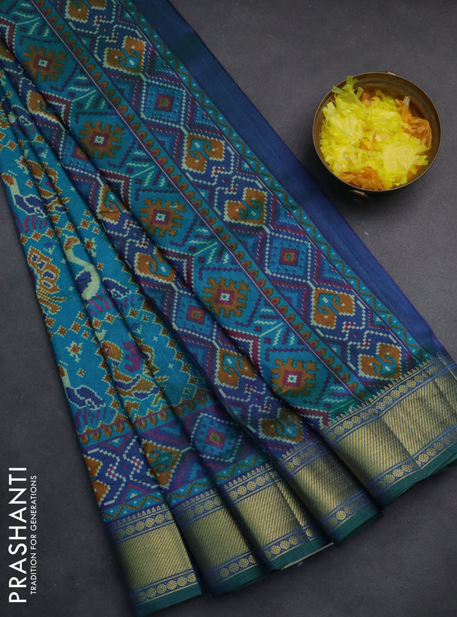 Semi tussar saree dual shade of teal blue and dark blue with allover ikat prints and zari woven border