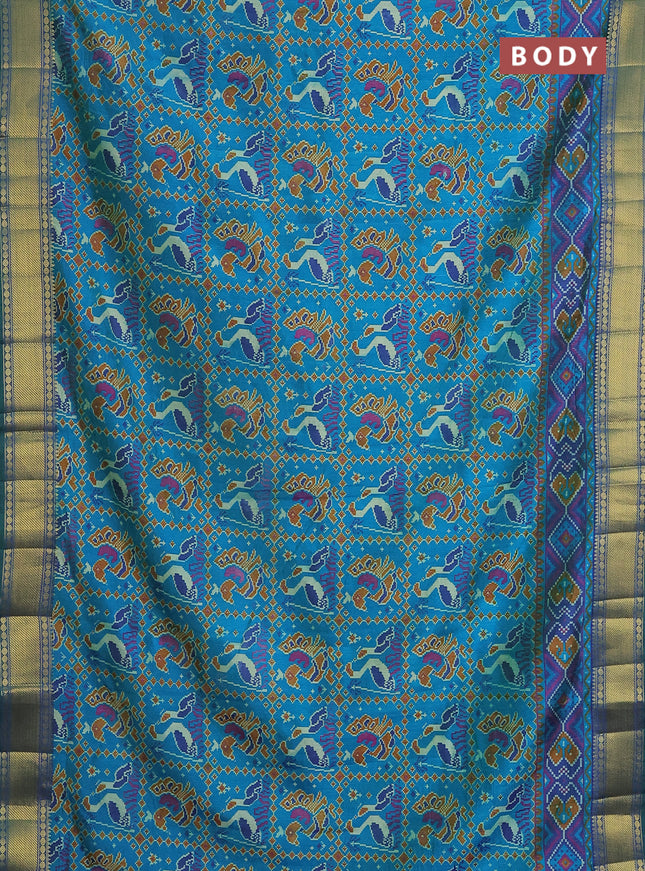 Semi tussar saree dual shade of teal blue and dark blue with allover ikat prints and zari woven border