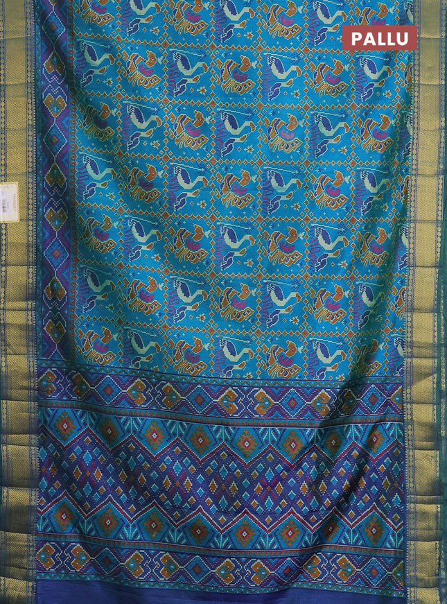 Semi tussar saree dual shade of teal blue and dark blue with allover ikat prints and zari woven border