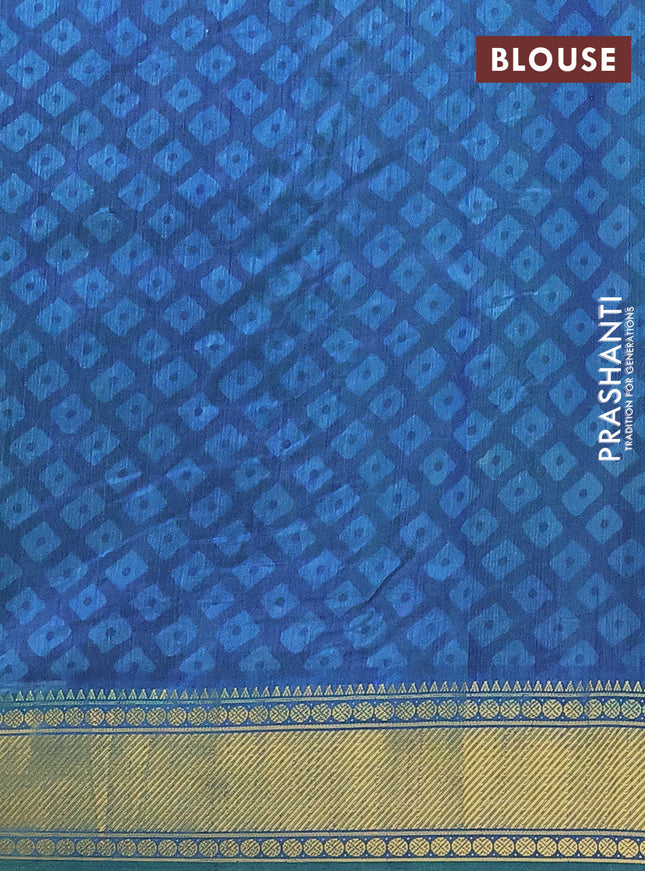 Semi tussar saree dual shade of teal blue and dark blue with allover ikat prints and zari woven border