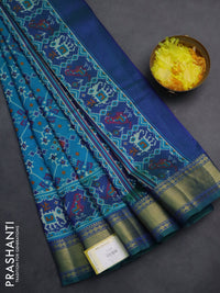 Semi tussar saree cs blue and dual shade of green with allover ikat prints and zari woven border