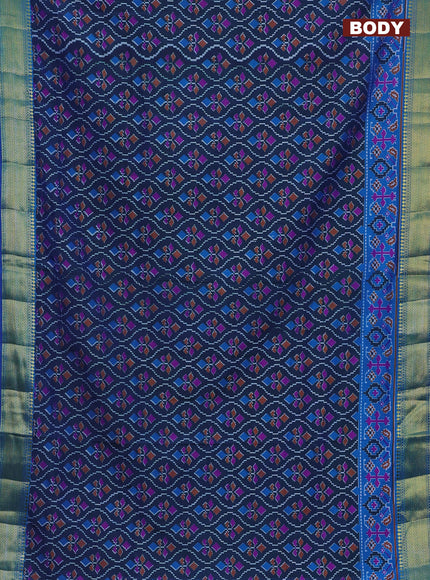 Semi tussar saree dual shade of bluish green and blue with allover ikat prints and zari woven border