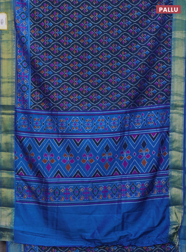 Semi tussar saree dual shade of bluish green and blue with allover ikat prints and zari woven border