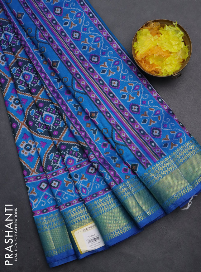 Semi tussar saree dual shade of bluish green and cs blue with allover ikat prints and zari woven border