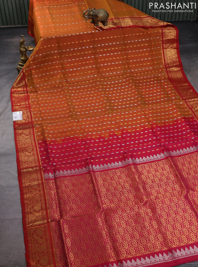 Pure uppada silk saree dual shade of dark mustard and pink red with allover silver & gold zari woven butta weaves and zari woven border