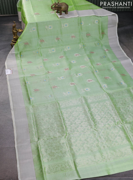 Pure uppada silk saree pista green with silver zari woven floral buttas and silver zari woven border