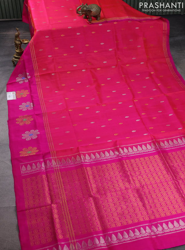 Pure uppada silk saree dual shade of pinkish orange and pink with silver & gold zari woven buttas and zari woven floral design butta border