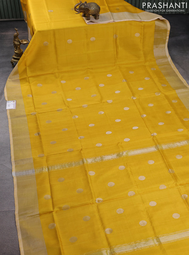 Pure uppada silk saree yellow with silver zari woven coin buttas and silver zari woven border
