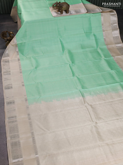 Pure soft silk saree teal green shade and beige with allover checked pattern and rettapet silver zari woven border