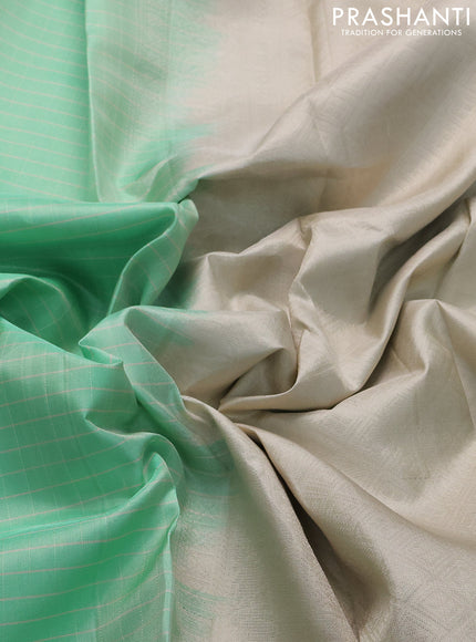 Pure soft silk saree teal green shade and beige with allover checked pattern and rettapet silver zari woven border