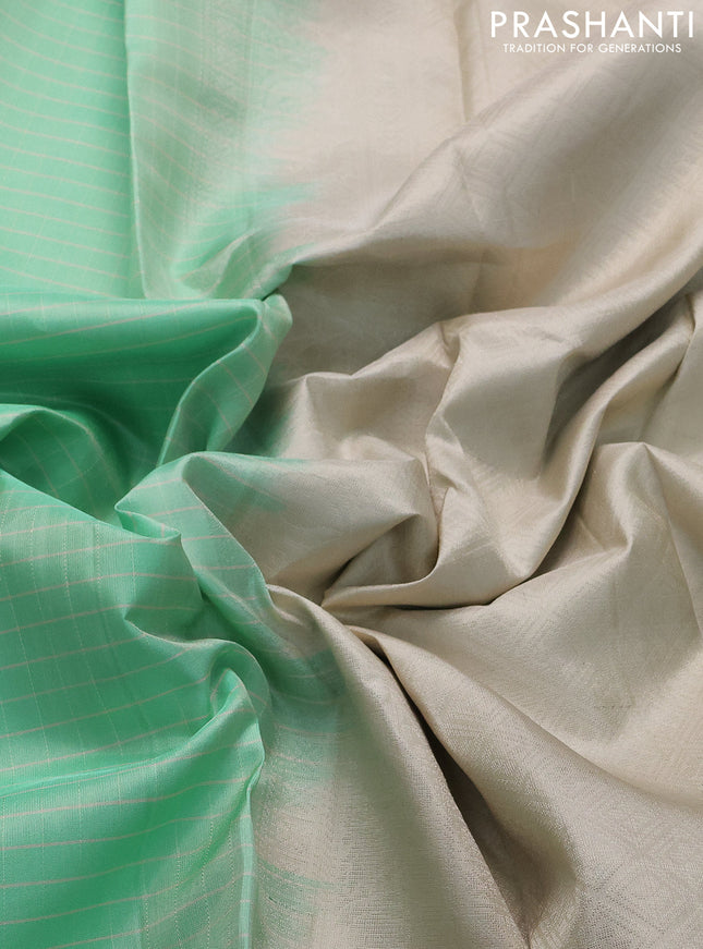 Pure soft silk saree teal green shade and beige with allover checked pattern and rettapet silver zari woven border