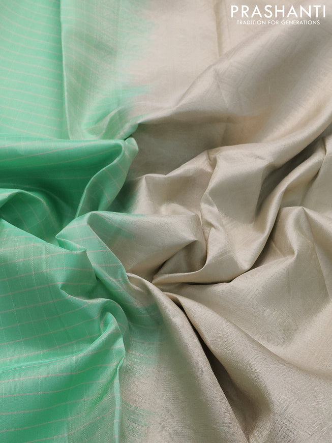 Pure soft silk saree teal green shade and beige with allover checked pattern and rettapet silver zari woven border