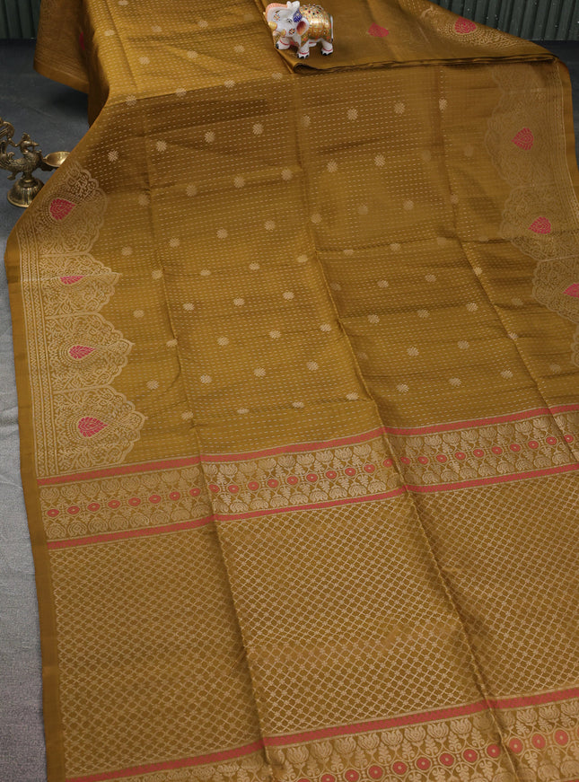 Pure soft silk saree mehendi green with allover zari woven butta weaves and zari woven border