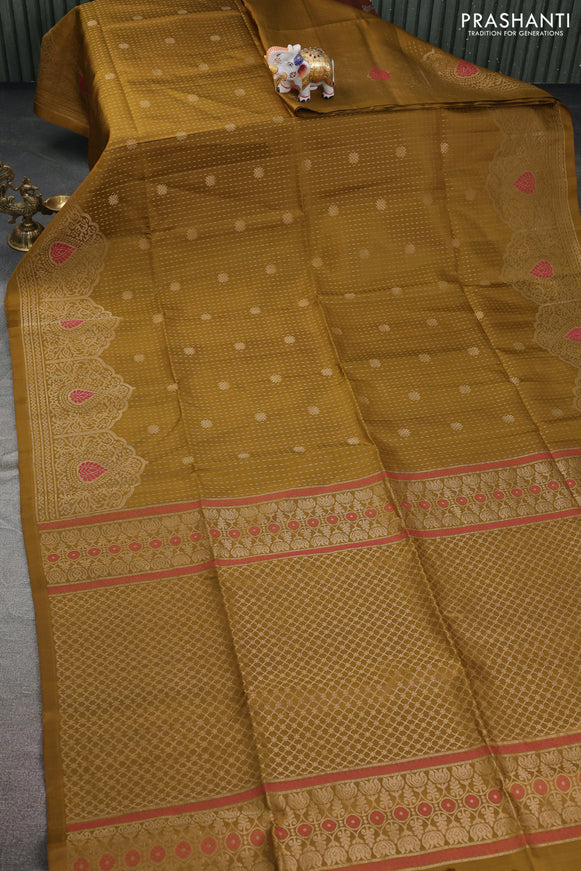 Pure soft silk saree mehendi green with allover zari woven butta weaves and zari woven border