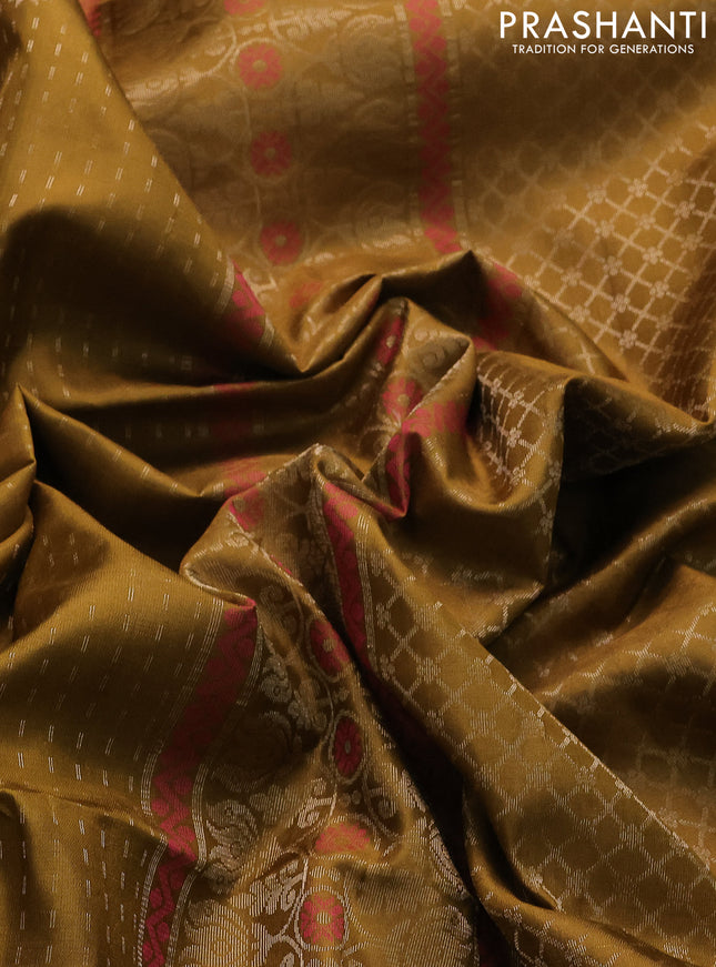 Pure soft silk saree mehendi green with allover zari woven butta weaves and zari woven border