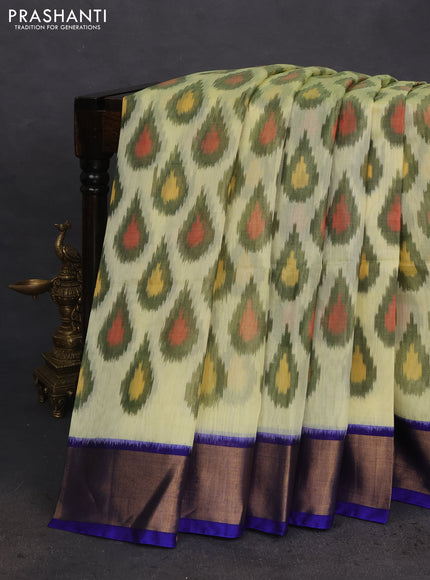 Ikat silk cotton saree pista green and blue with allover ikat weaves and zari woven border