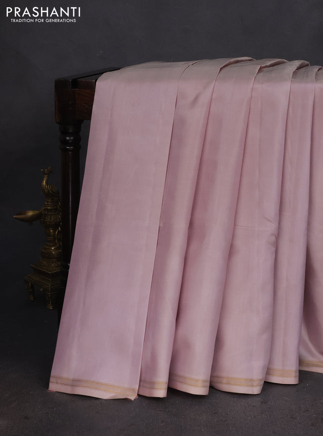 Pure kanchipuram silk saree beige and pink with plain body and small zari woven border