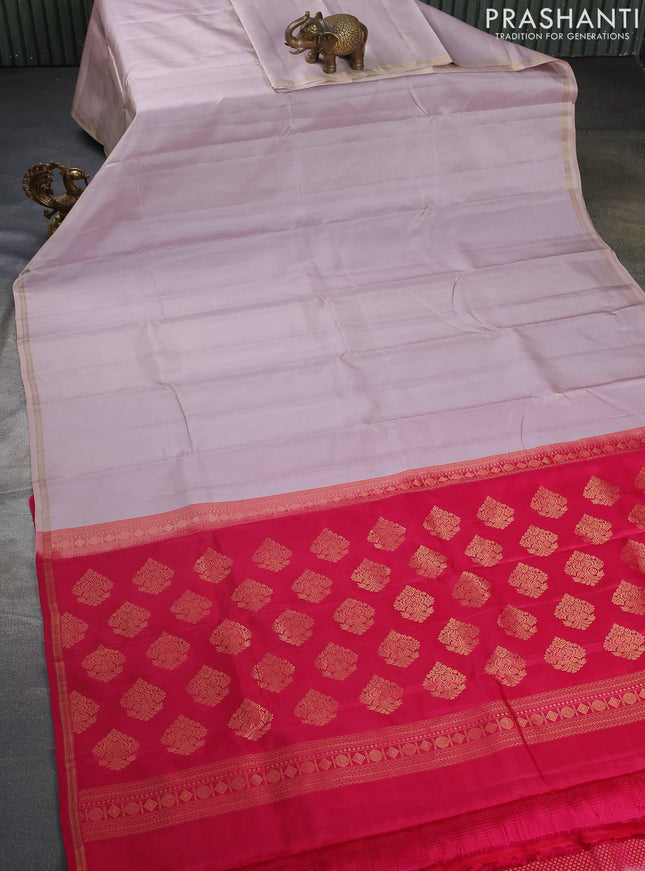 Pure kanchipuram silk saree beige and pink with plain body and small zari woven border