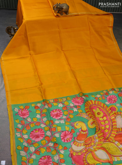 Pure soft silk saree mustard yellow and green with plain body and hand painted kalamkari printed pallu