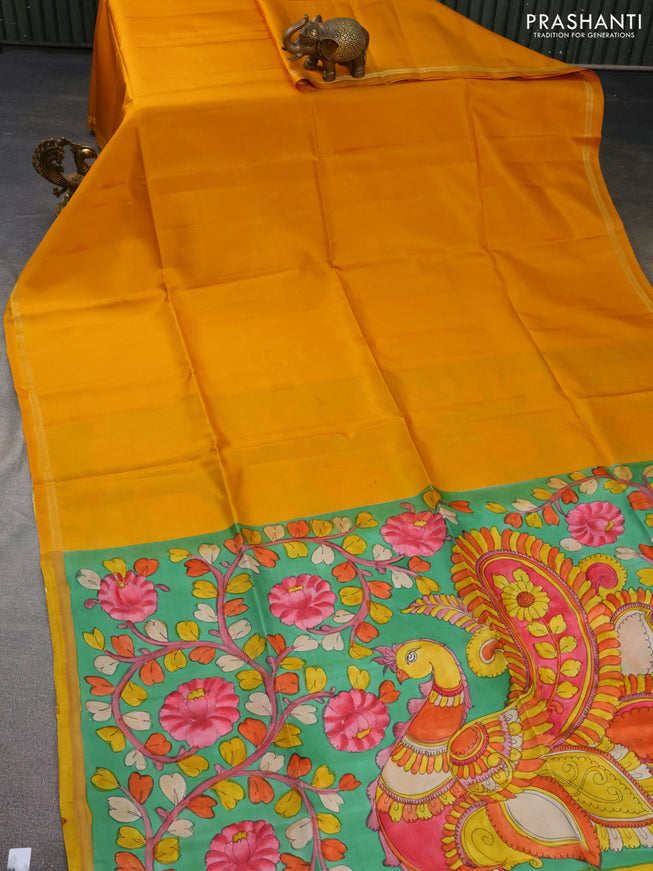 Pure soft silk saree mustard yellow and green with plain body and hand painted kalamkari printed pallu