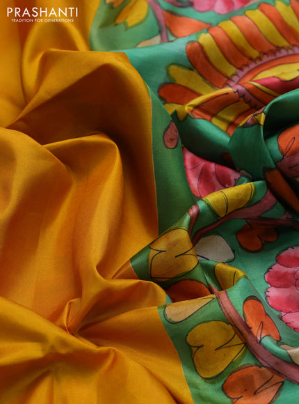 Pure soft silk saree mustard yellow and green with plain body and hand painted kalamkari printed pallu