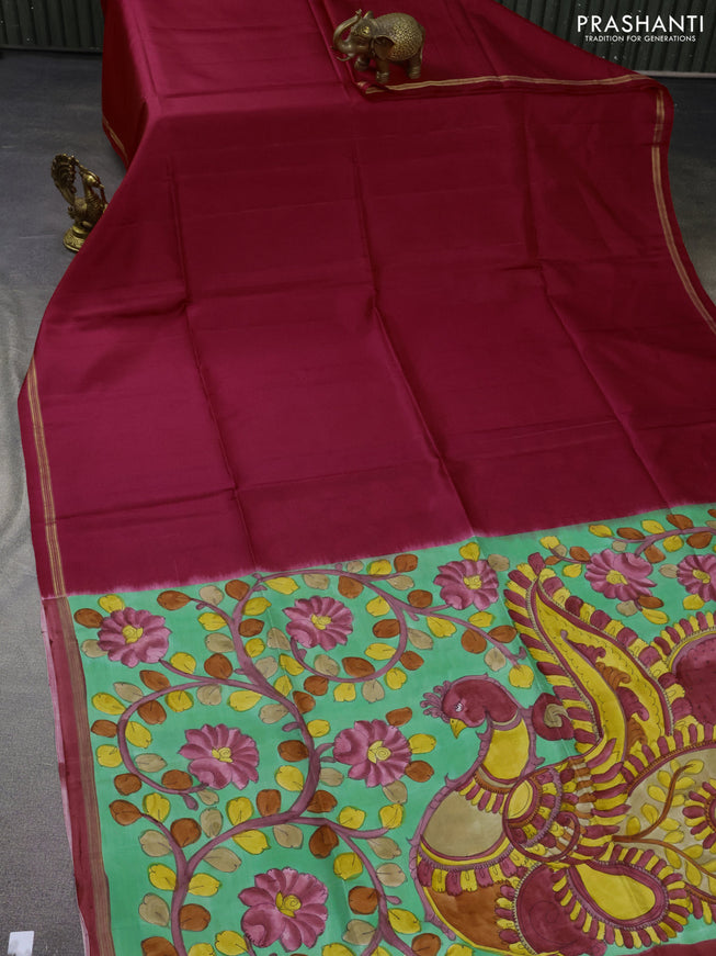 Pure soft silk saree reddish pink and pastel green with plain body and hand painted kalamkari printed pallu
