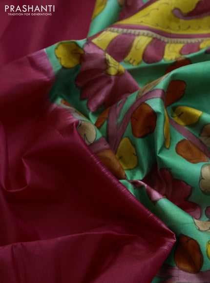 Pure soft silk saree reddish pink and pastel green with plain body and hand painted kalamkari printed pallu
