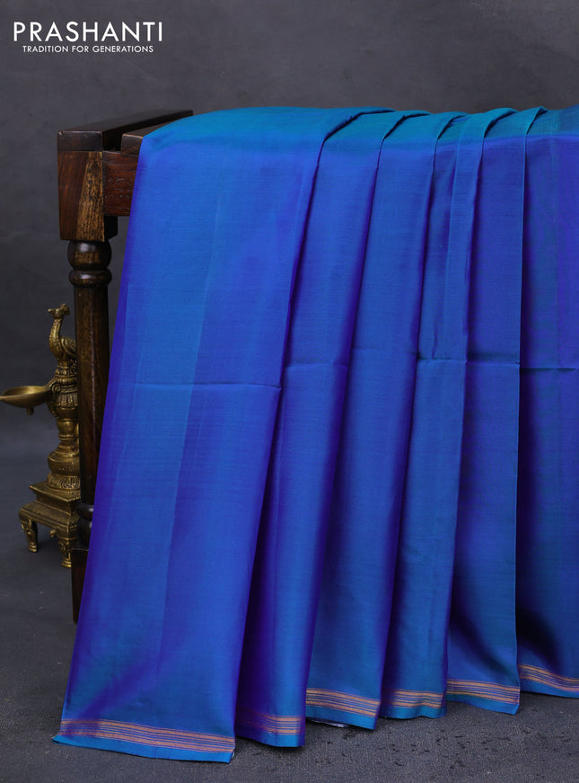 Pure soft silk saree dual shade of bluish green and cream with plain body and hand painted kalamkari printed pallu