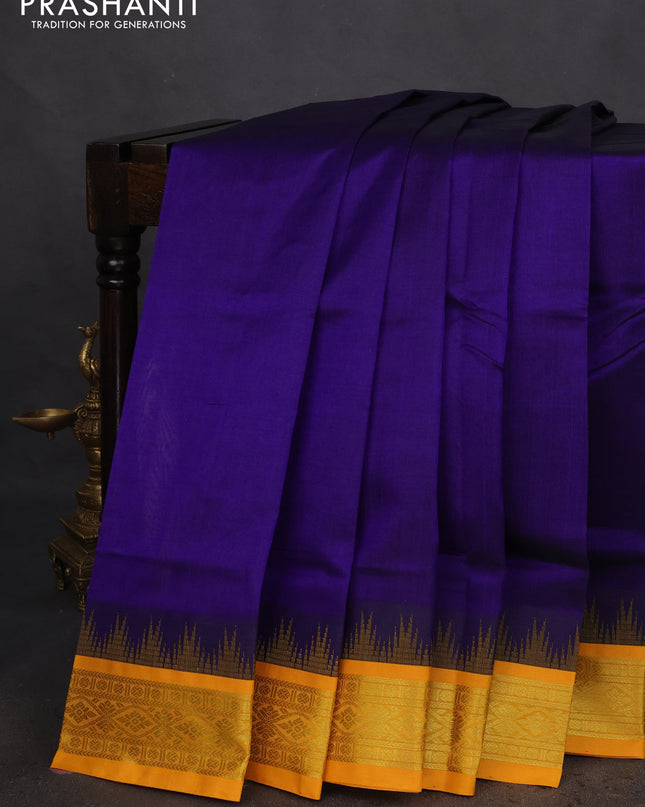 Silk cotton saree blue and yellow with plain body and temple design zari woven korvai border