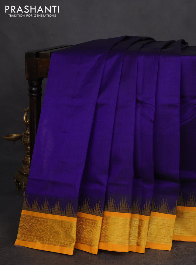 Silk cotton saree blue and yellow with plain body and temple design zari woven korvai border