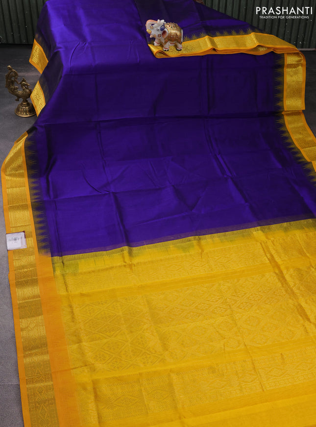 Silk cotton saree blue and yellow with plain body and temple design zari woven korvai border